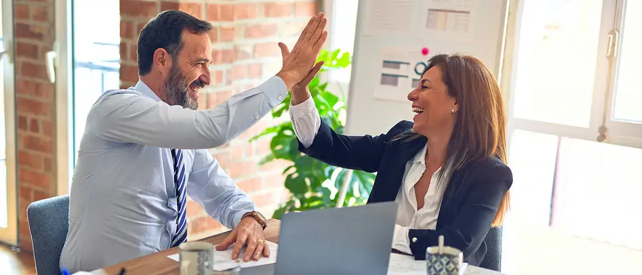 Colleagues "high-fiving" eachother
