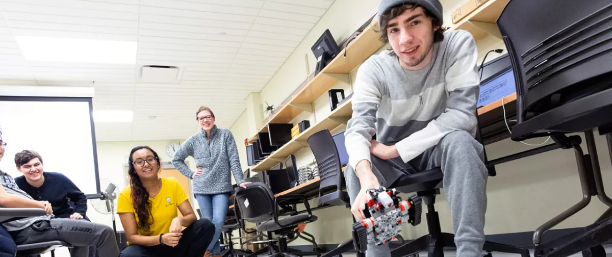 Students working together to test a robot.