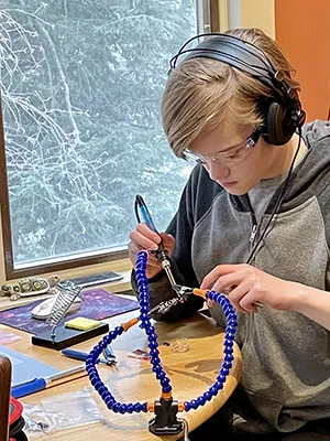 Go STEM student soldering