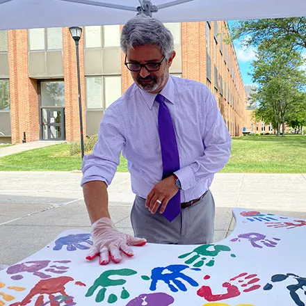 Faculty Place Hands on Wings