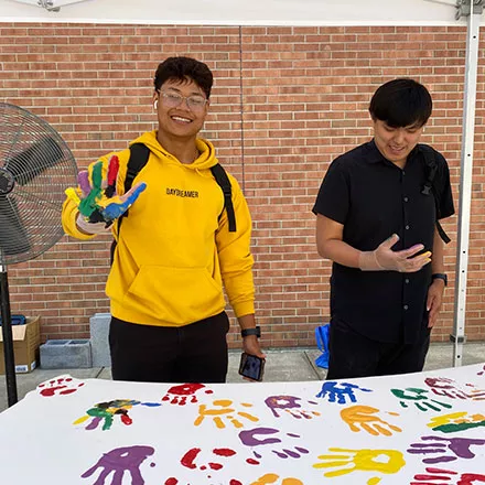 Students Place Hands on Wings