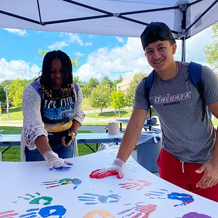 Students Place Hands on Wings