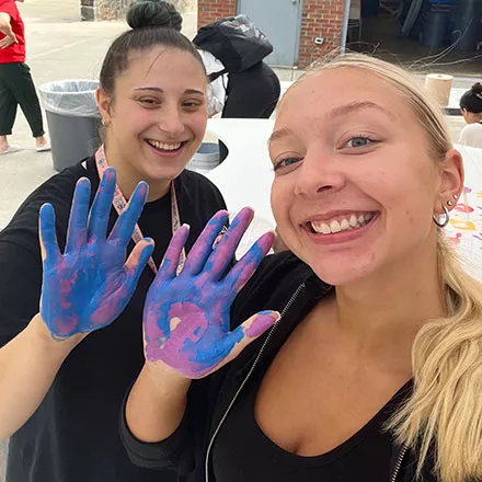 Students Place Hands on Wings