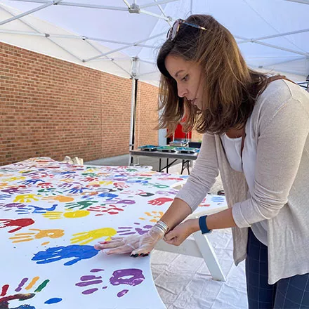 Students Place Hands on Wings