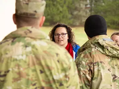 soldiers and students engaged in an exercise that took them out of a classroom