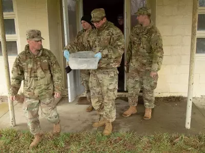 soldiers and students engaged in an exercise that took them out of a classroom