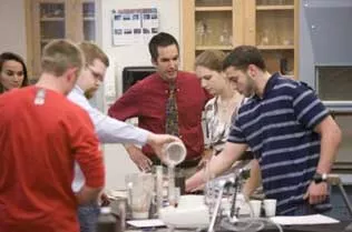 Students testing different foods in a lab.