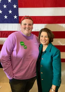 Student stands with Amy Klobuchar